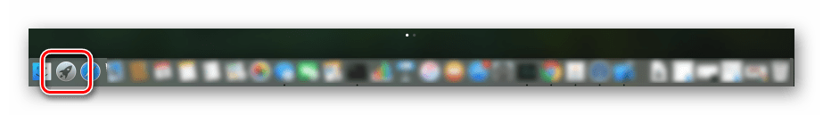 Запуск Launchpad через системный док на компьютере с macOS